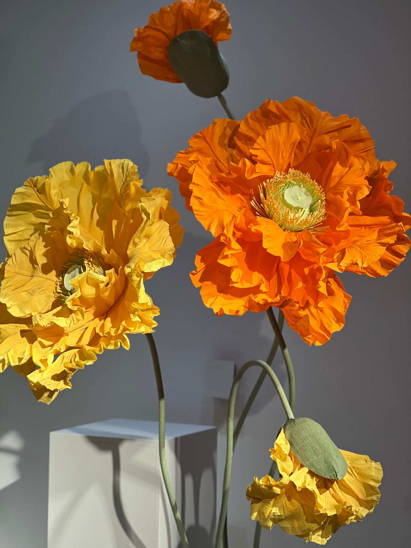 Giant Orange and Yellow Paper Flowers on Metal Stands – Event Essentials