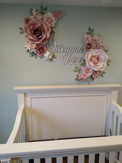 Handcrafted paper flowers beautifully arranged in a nursery, adding a touch of whimsy and charm to the room