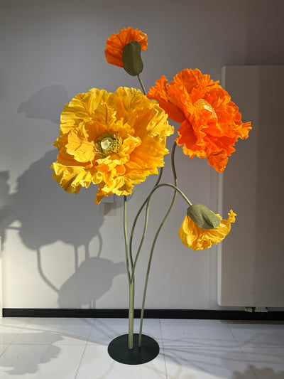 Elevate Your Event with Big Orange and Yellow Paper Flowers on Metal Stands