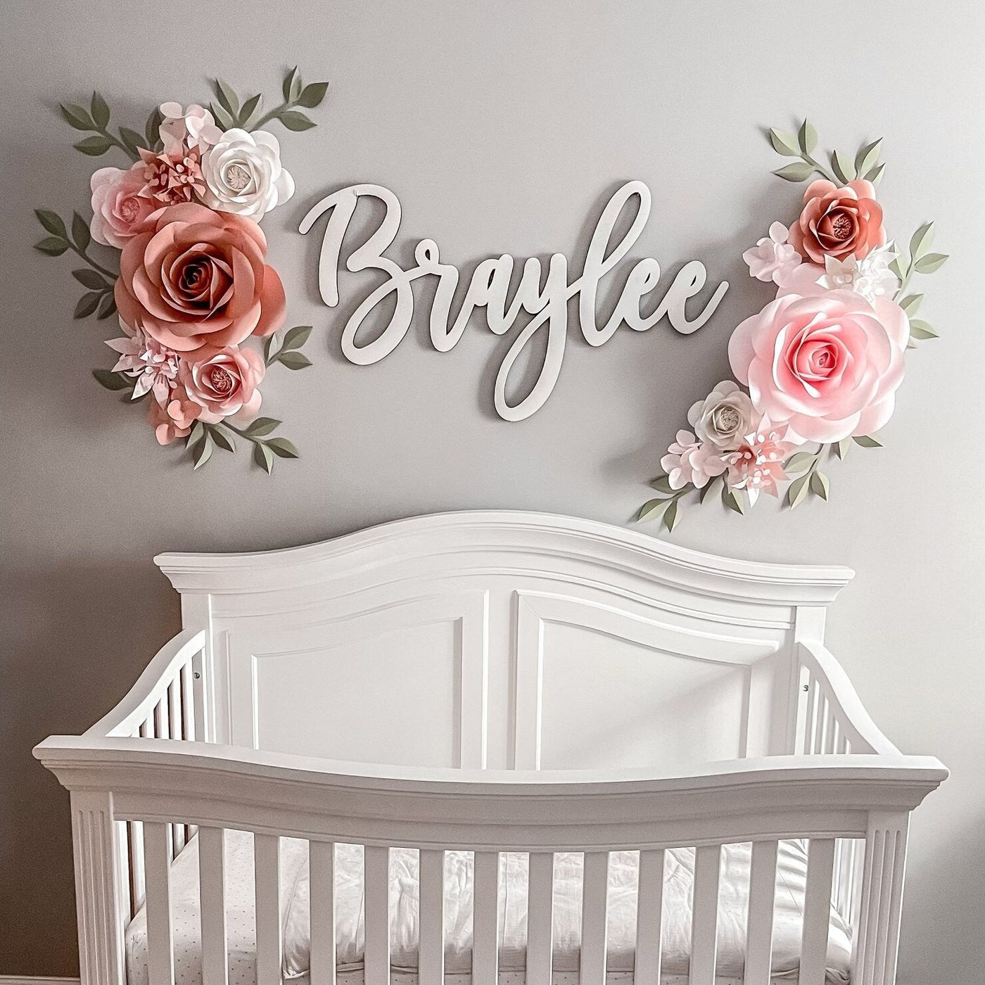 Discover the magic of our handcrafted paper flower set for your nursery. In delicate blush, nude, and dusty rose hues, these blooms effortlessly enhance your nursery decor, especially when paired with Caden Lane Millie's Dusty Rose crib bedding.
