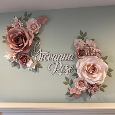 Paper flowers adorning a nursery wall as colorful and charming decorations
