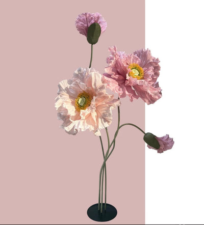 Stunning giant flowers showcased on sturdy stands, making a bold statement in any space.