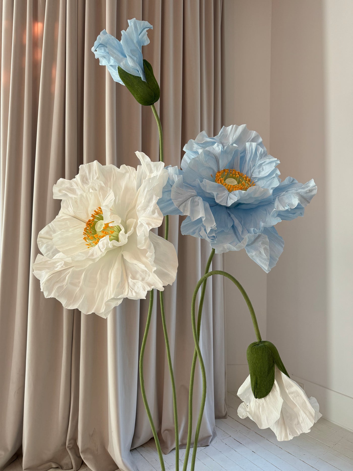 Large paper flower buds and blooms for party decorations