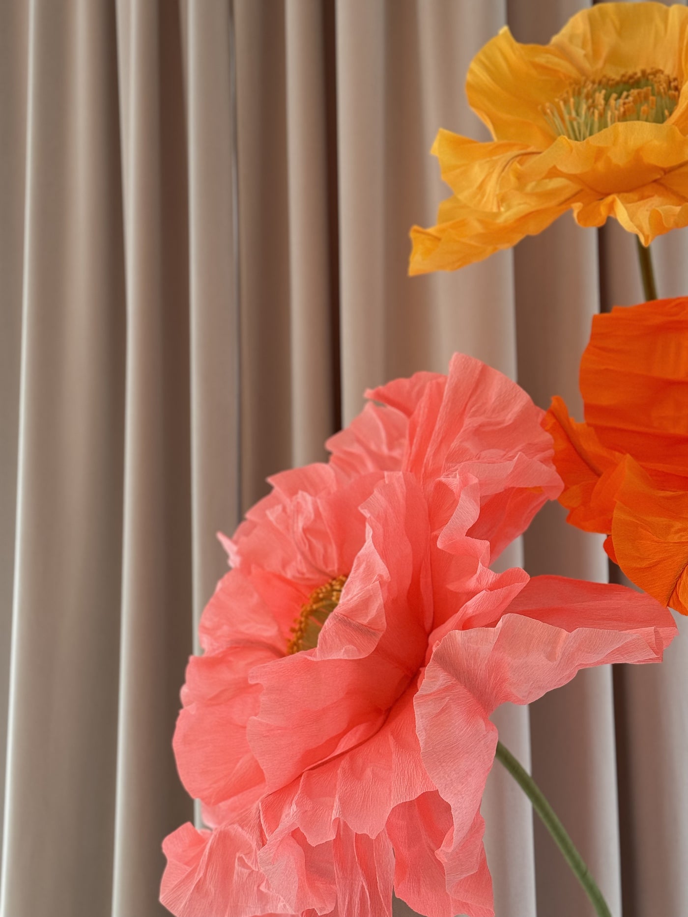 Oversized paper flowers in hot pink and orange from Mio Gallery for wedding backdrop