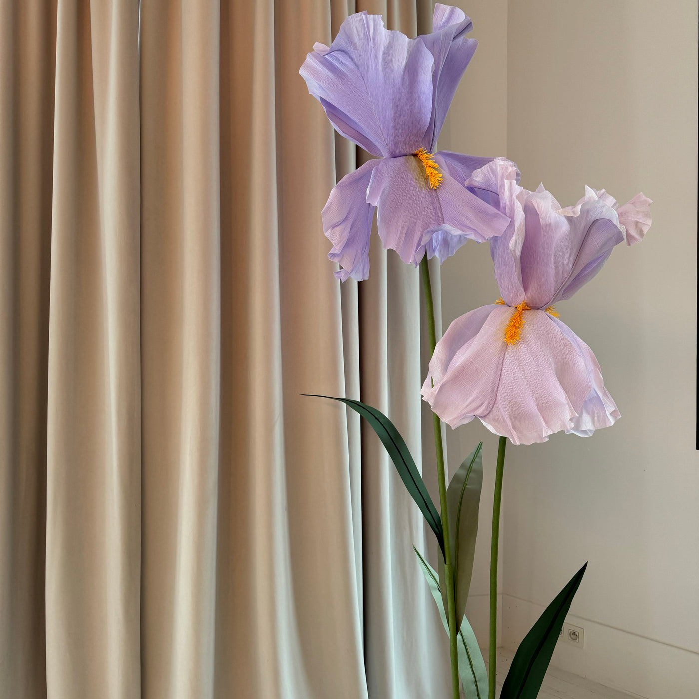 Oversized standing paper iris flowers with green leaves for decoration