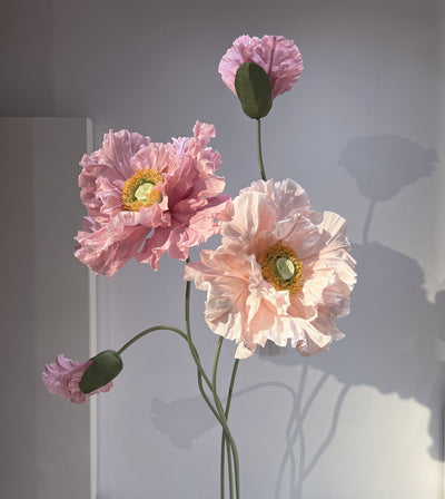 Set of 4 giant paper poppies on sleek stands, perfect for event decor.