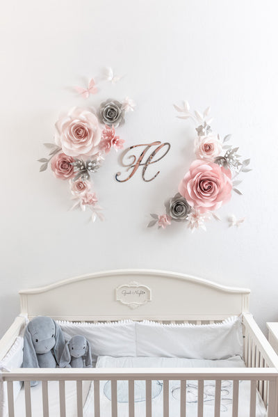 Elegant floral arrangement in blush, light grey, and nude hues for nursery