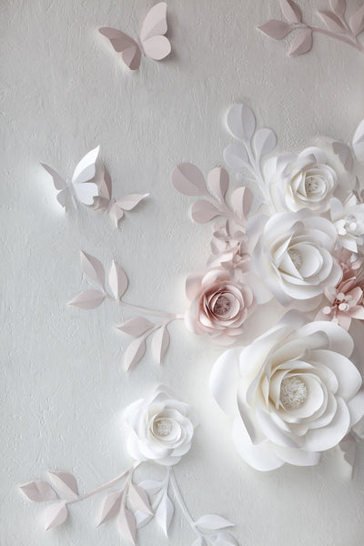 Whimsical and enchanting paper flower backdrop for a magical wedding setting